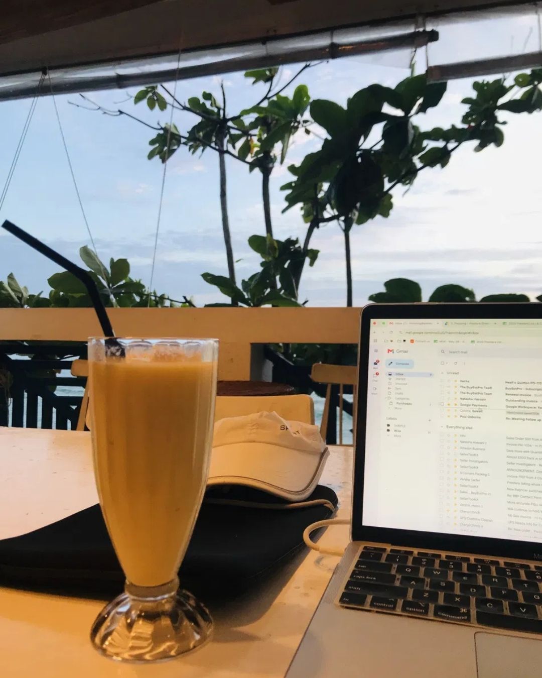Mango shake and laptop, working with a view