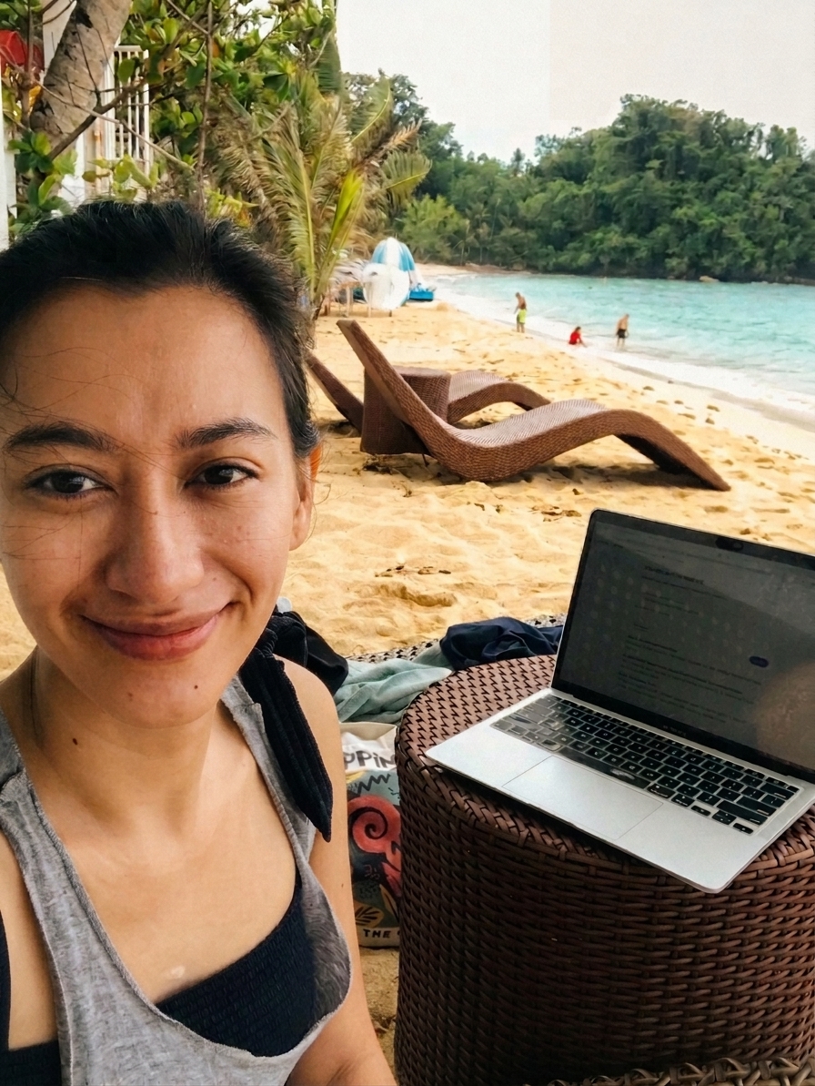 Working from the beach, smiling despite it all